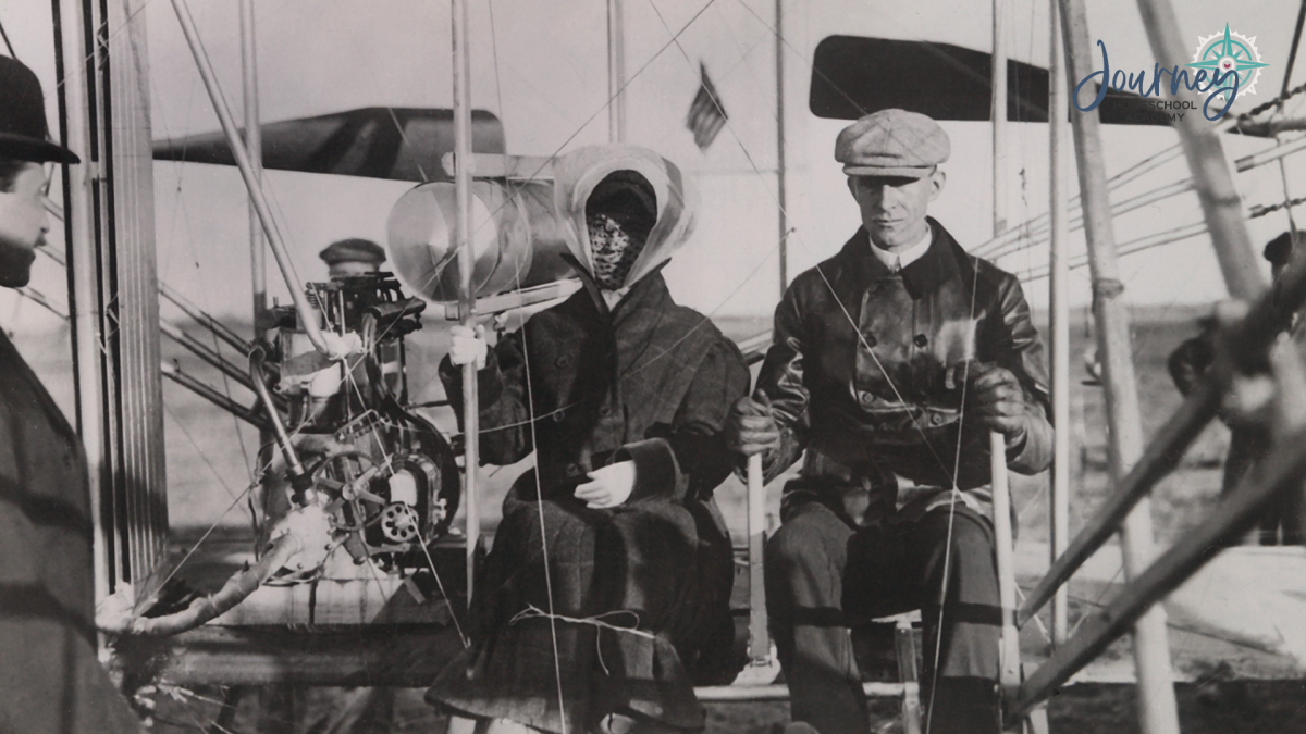 Historic photo of the Wright brothers with their early aircraft, a cornerstone of flight history explored in homeschool physics with Journey Homeschool Academy.
