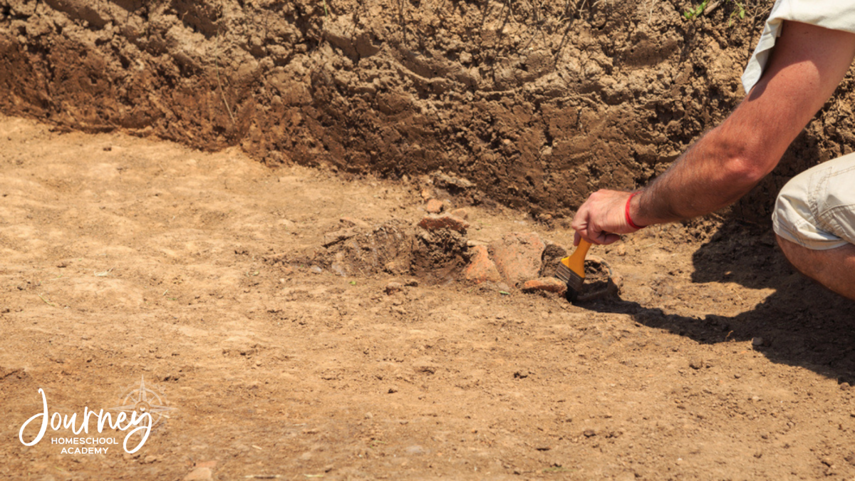 “Archaeology and the Bible: 5 Discoveries That Bring Scripture to Life in Your Homeschool,” set against the desert cliffs of Qumran.